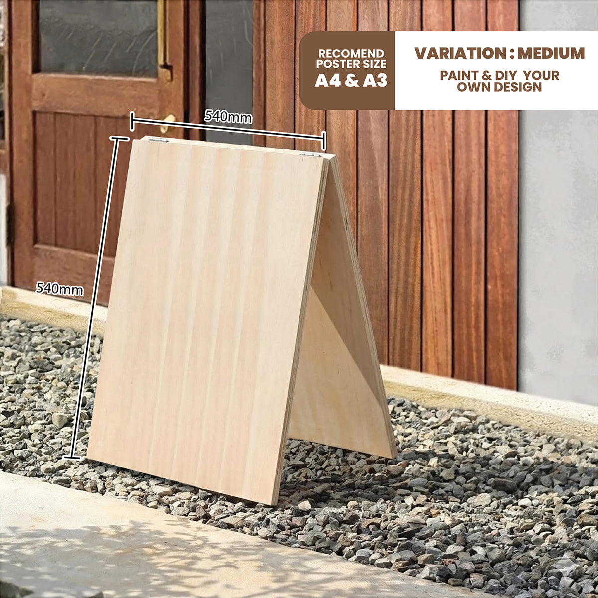 Wooden a-frame sign on gravel with measurement details and text about poster size and DIY design.