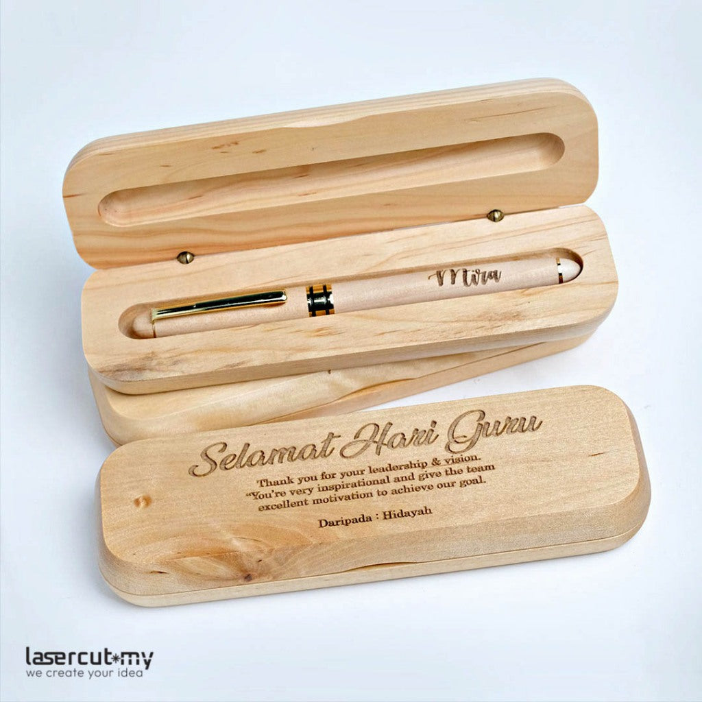 A personalized wooden pen with gold accents, engraved with a name, placed in an open wooden box with a lid, on a white background.