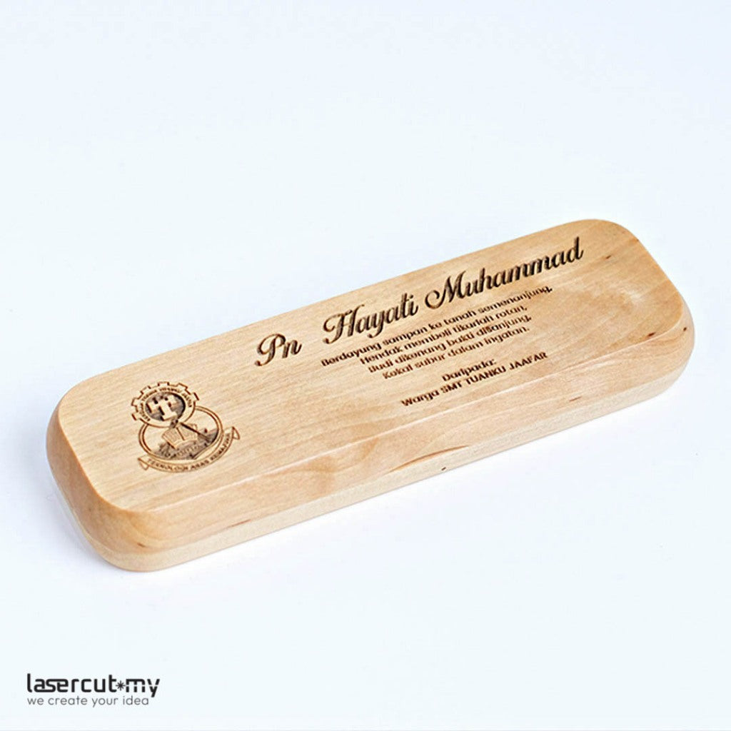 A personalized wooden pen with gold accents, engraved with a name, placed in an open wooden box with a lid, on a white background.