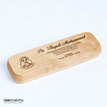 A personalized wooden pen with gold accents, engraved with a name, placed in an open wooden box with a lid, on a white background.