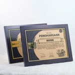 A personalized framed award with laser engraving, displayed on a stand.