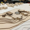 Model of a town layout with buildings on a raised platform