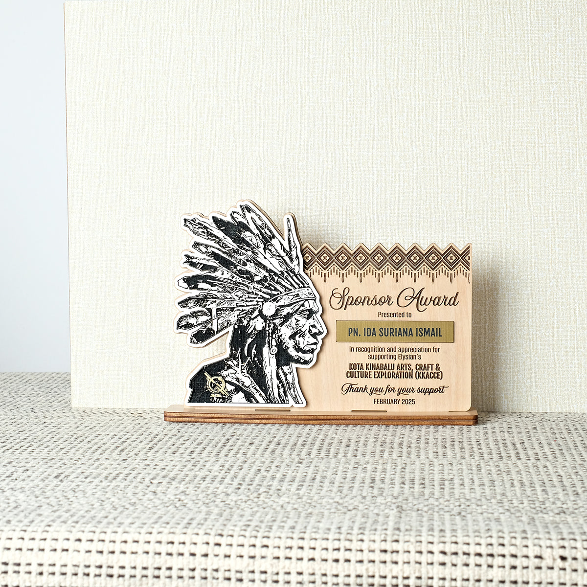 Sponsor award with Native American design on a textured surface